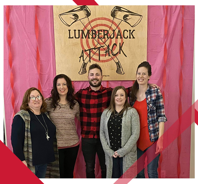 people at lumberjack attack axe throwing