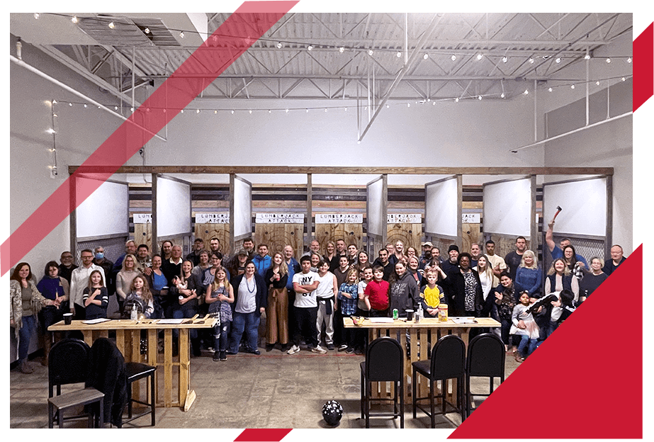 large group of people at axe throwing range