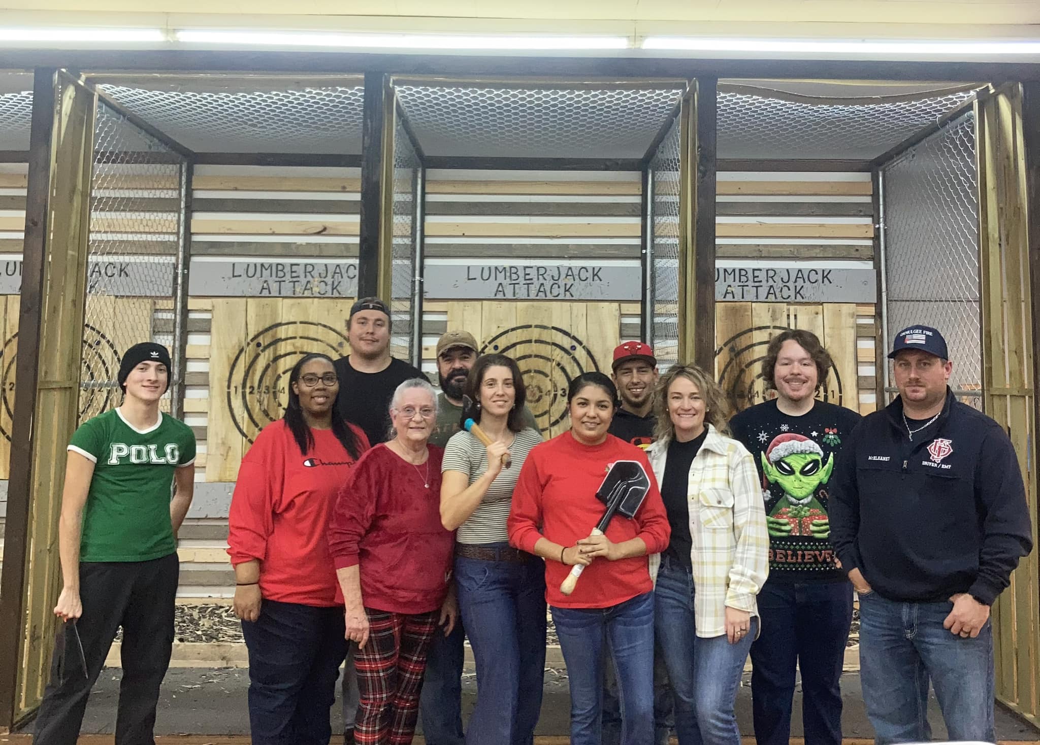 large group of people at axe throwing range