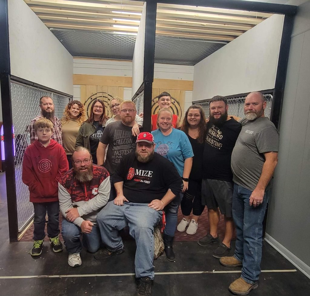 large group of people at axe throwing range