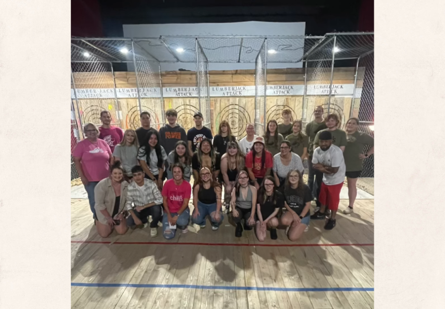 large group of people at axe throwing range